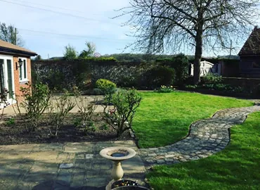 Stepping-stones through a kept lawn